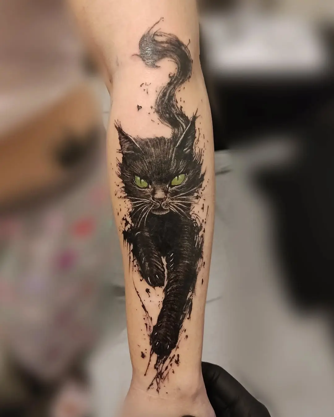 Expressive black cat tattoo in motion