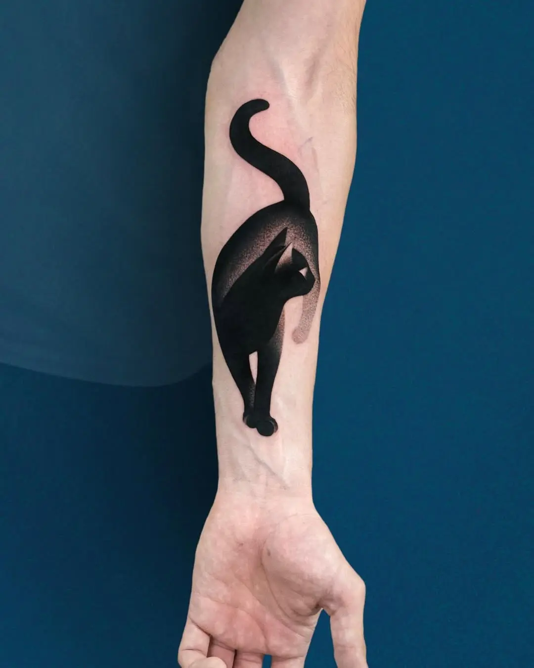 Elegant black cat silhouette tattoo design