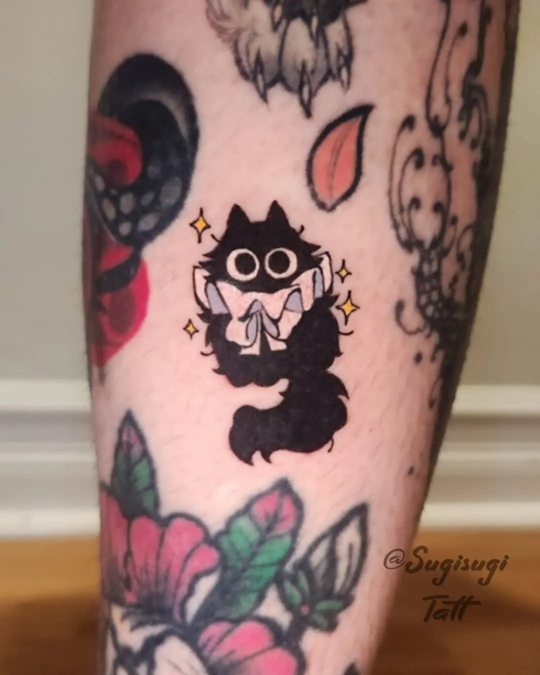 Funky black cat tattoo with playful vibes