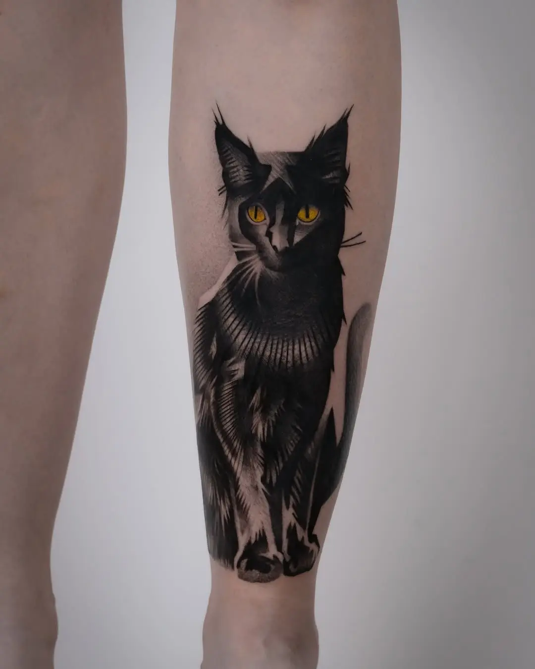 Striking black cat tattoo on the leg