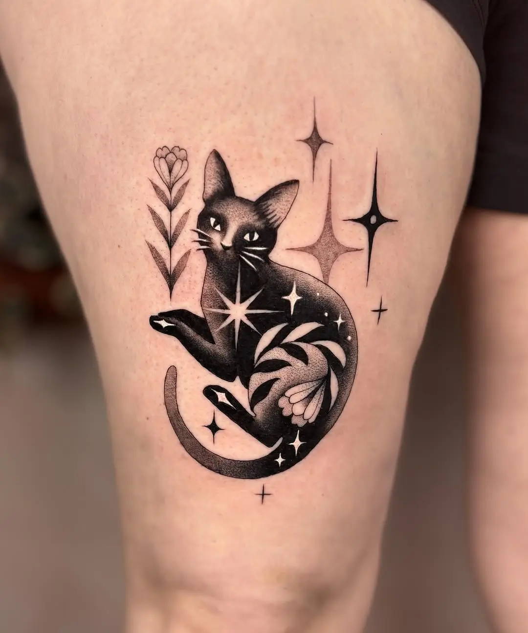Stunning black cat tattoo with cosmic elements