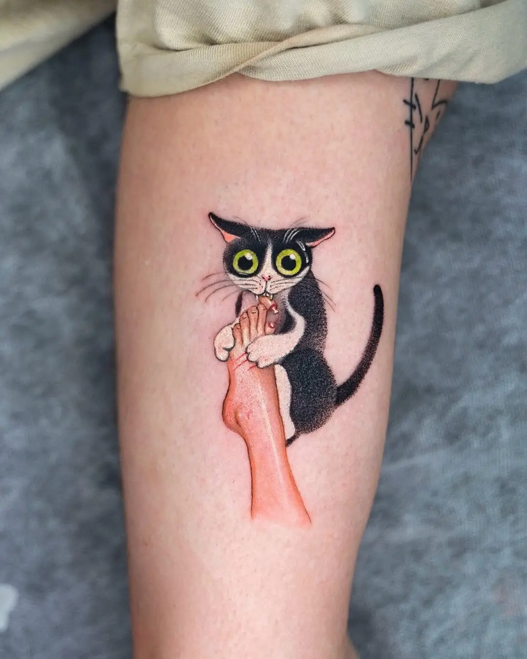 Quirky black cat tattoo with playful vibe