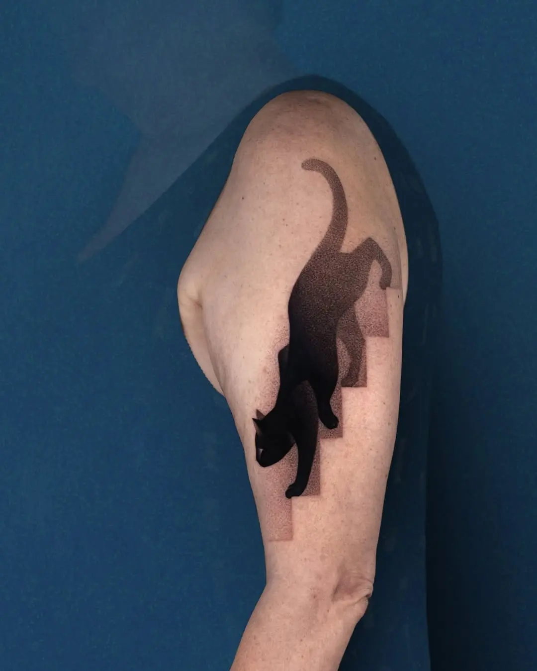 Sleek Black Cat Climbing Stairs Tattoo