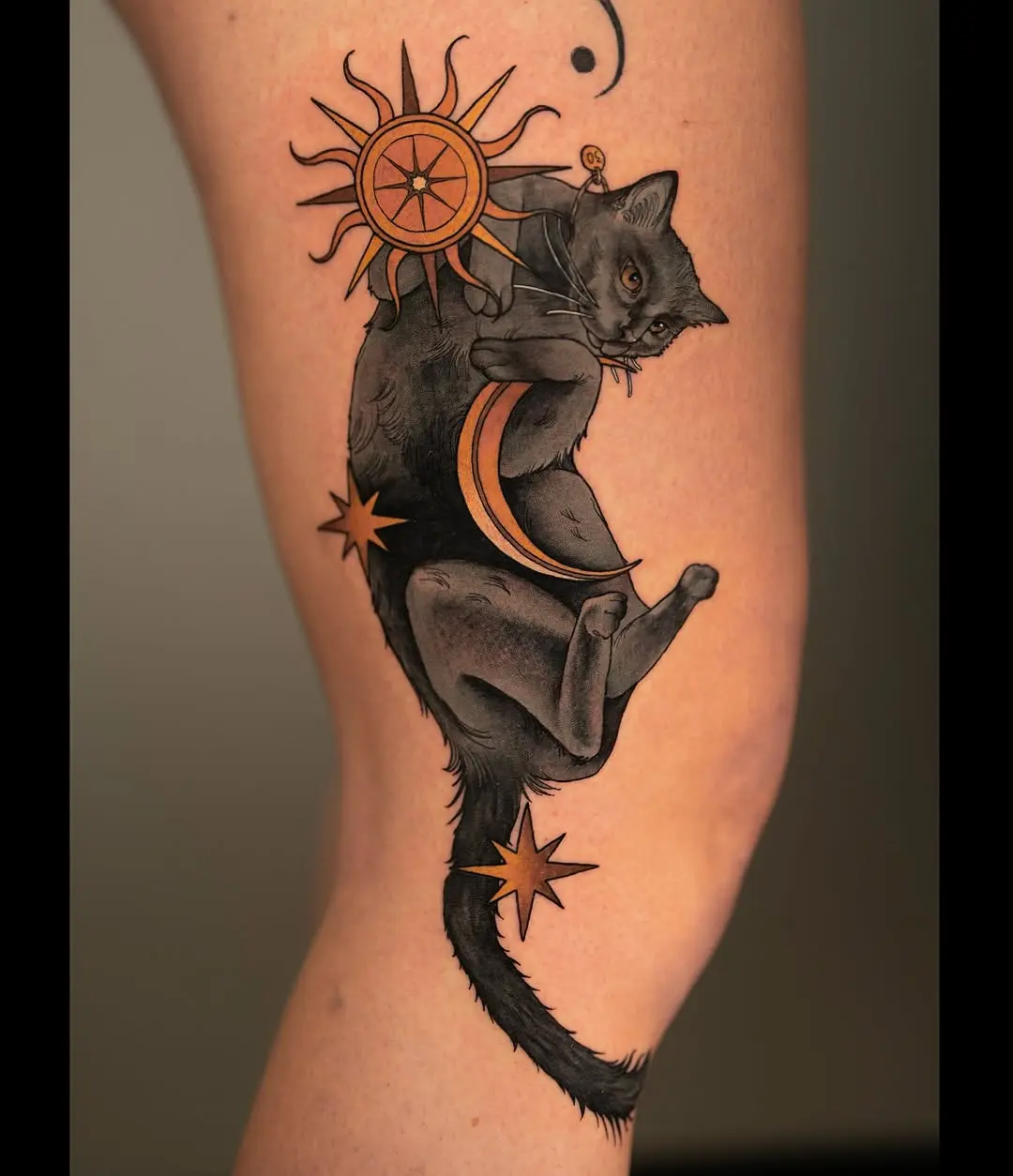 Elegant black cat tattoo with celestial elements