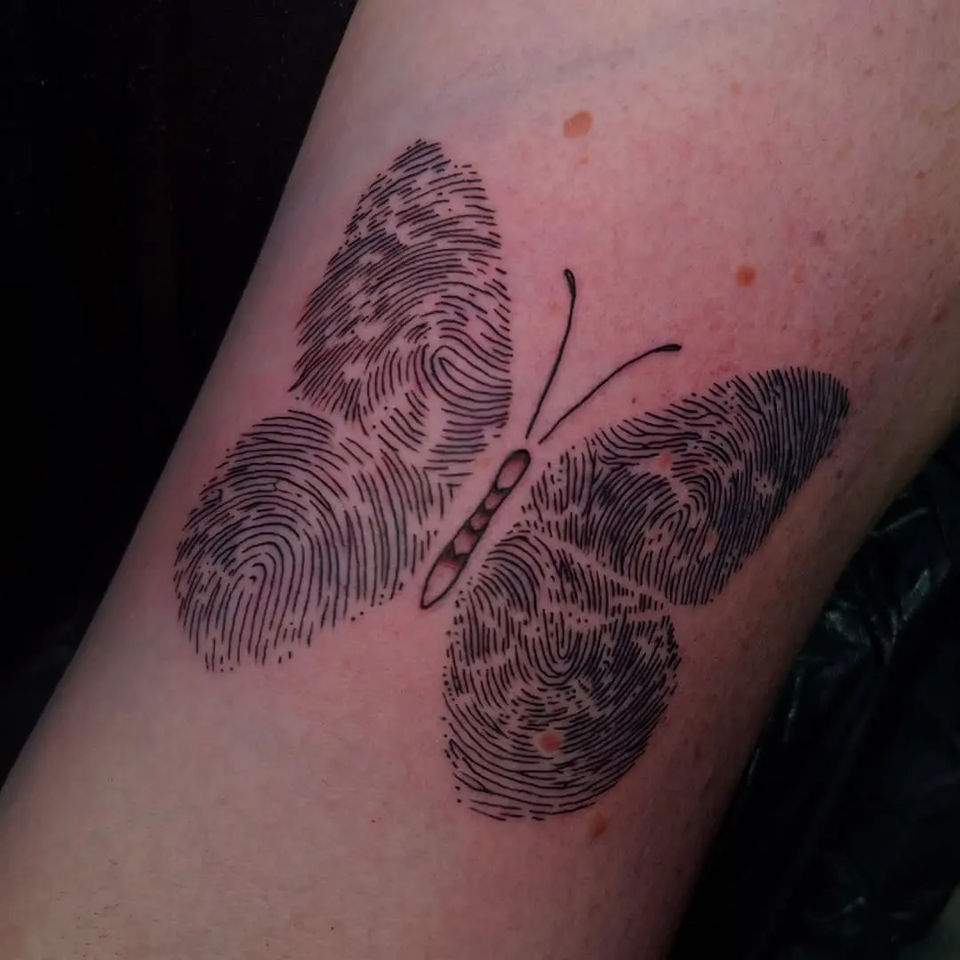 Stylish butterfly tattoo blending nature and identity