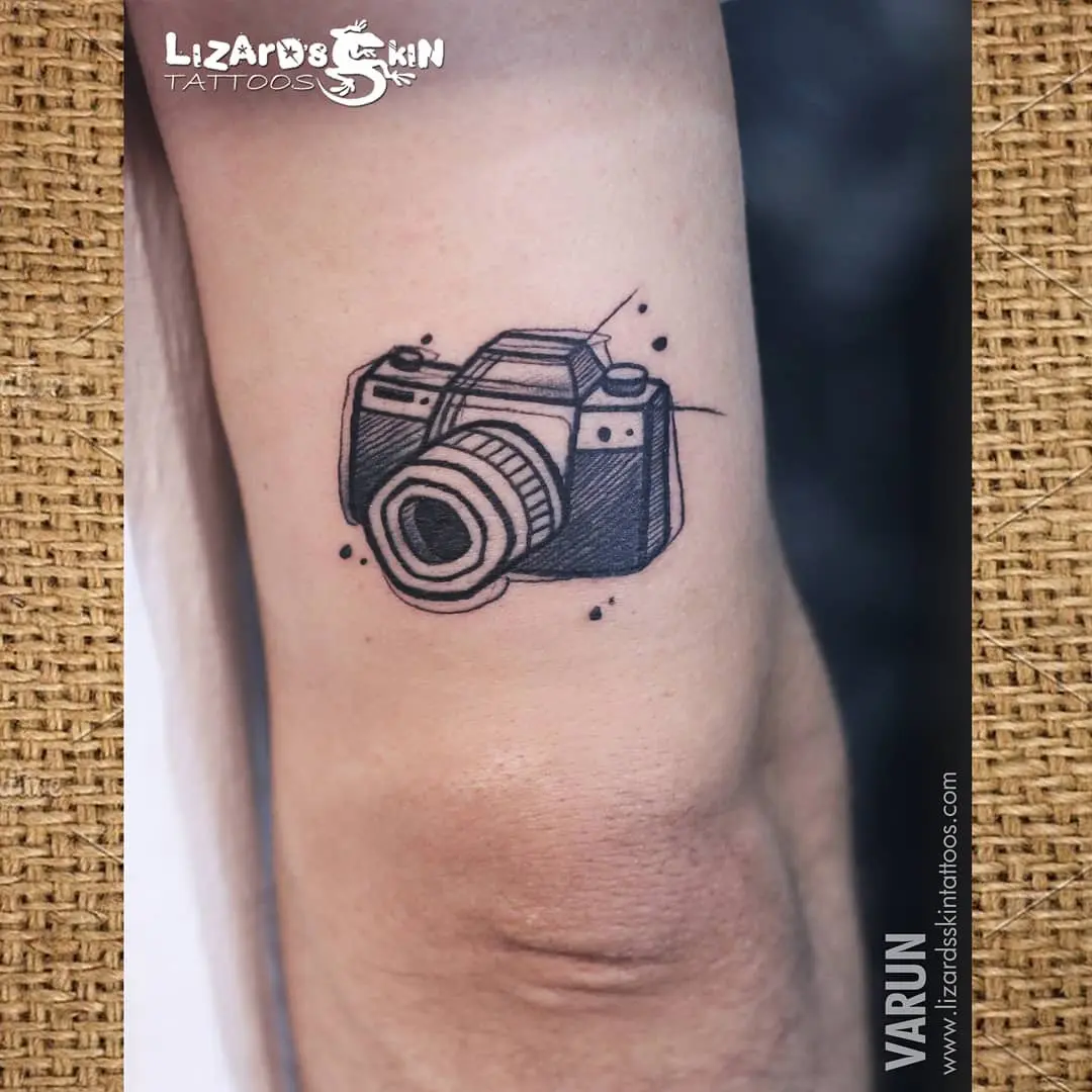 Unique camera tattoo design with artistic flair