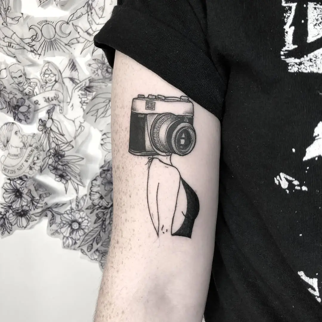 Stylish camera tattoo blending art and identity