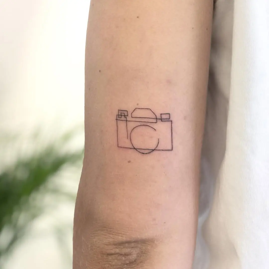 Minimalist camera tattoo for photography lovers