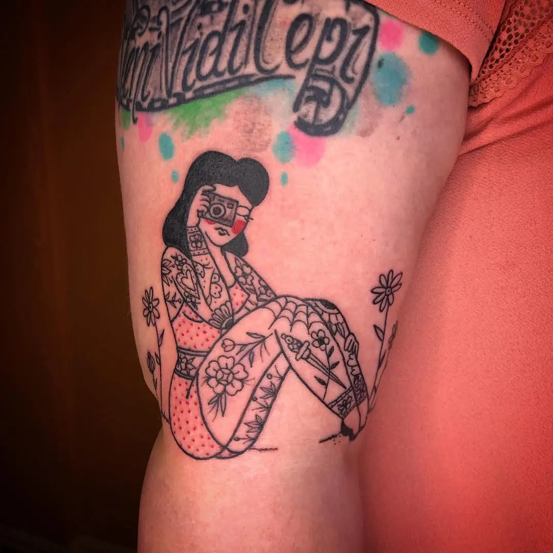 Stylish tattoo of a pin-up girl in bloom