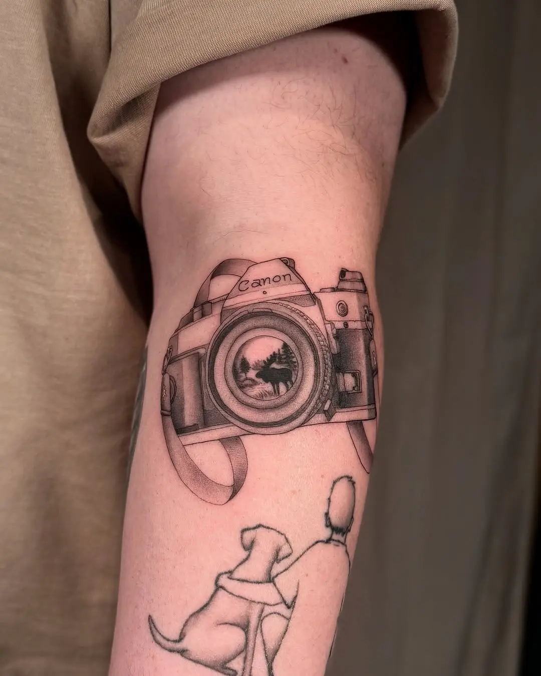 Realistic Canon camera tattoo with vivid detail