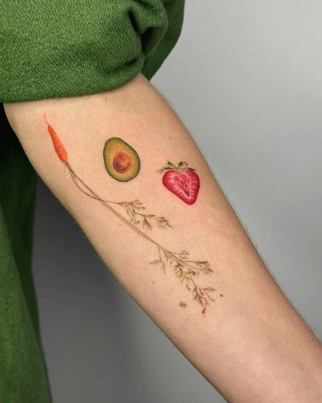 Colorful fruit and vegetable tattoo ensemble