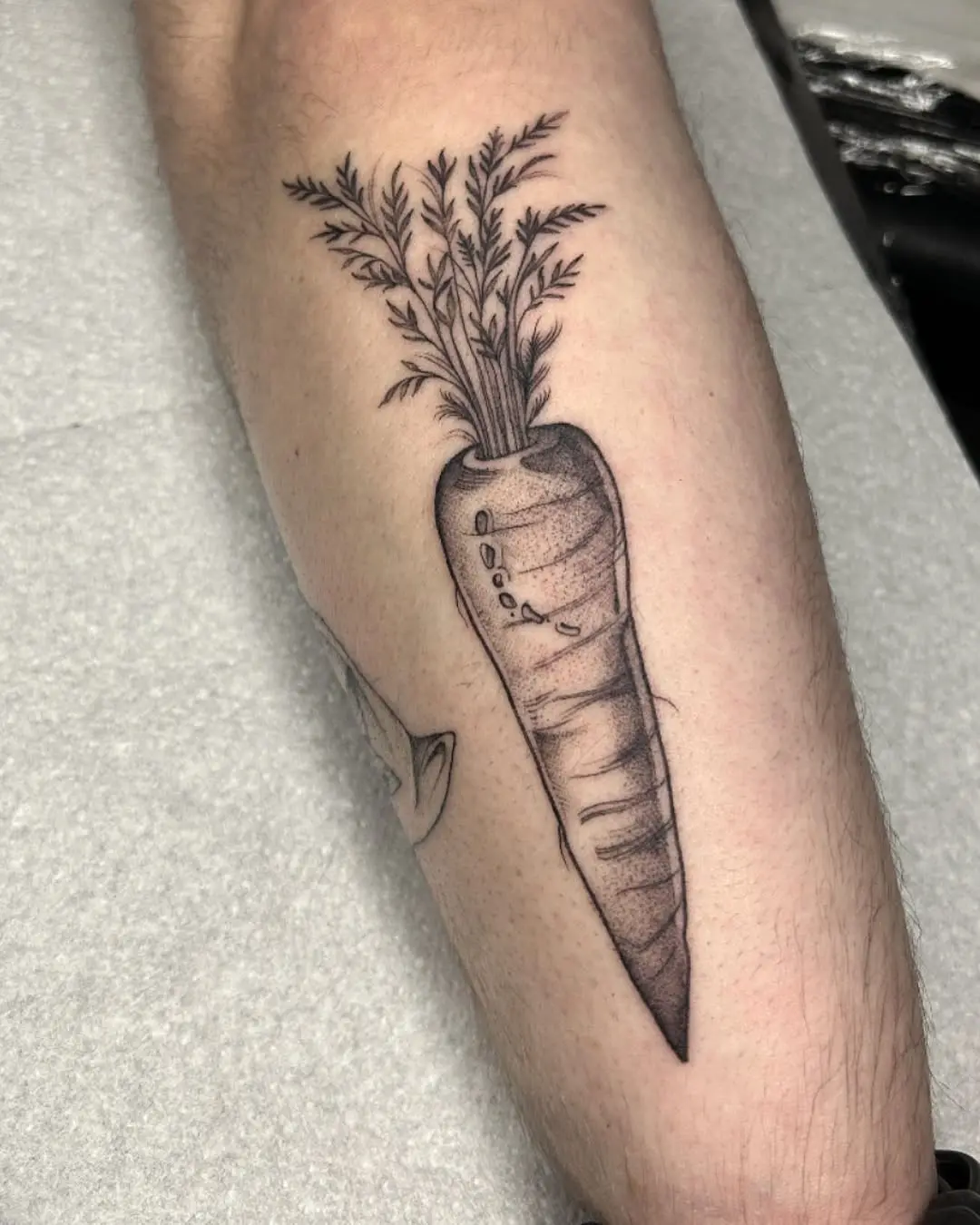 Stylish carrot tattoo showcasing intricate details