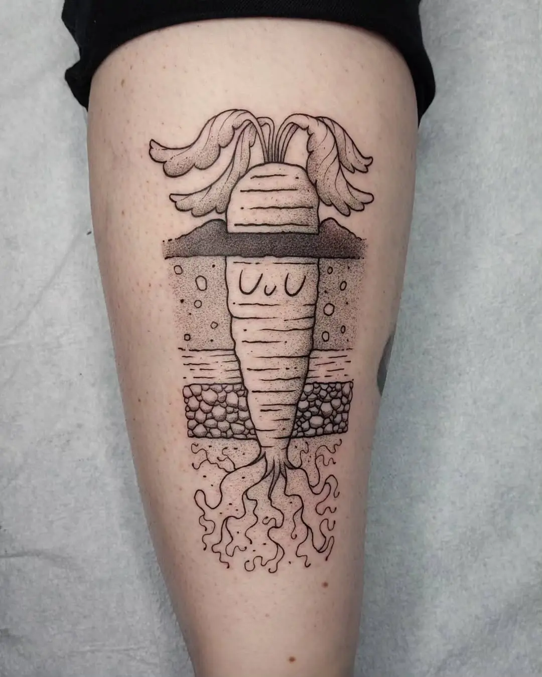 Whimsical carrot tattoo with charming character