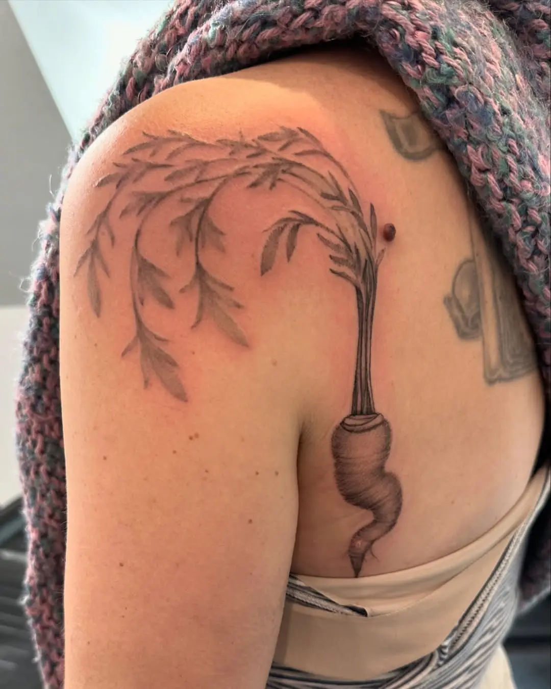 A unique and artistic carrot tattoo design