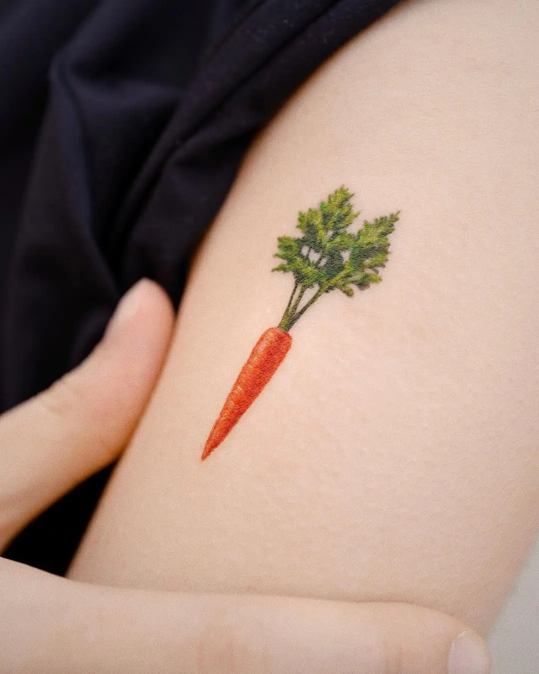 Artistic carrot tattoo with rich detailing