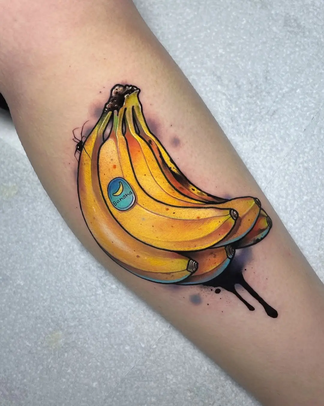 Vivid banana tattoo bursting with personality