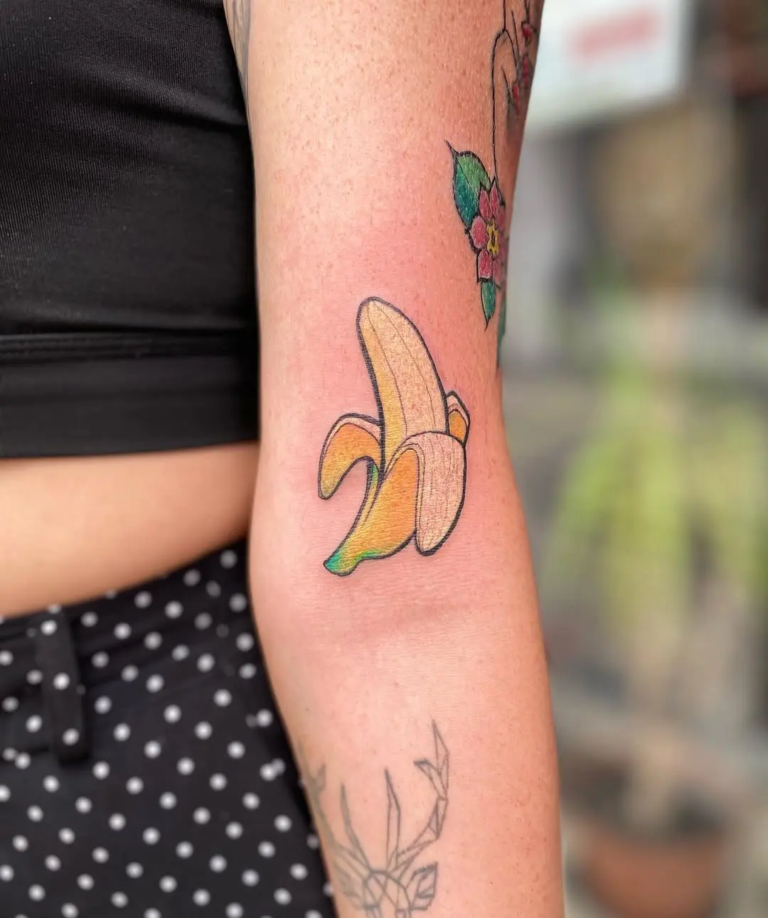 Vibrant Banana Tattoo on Elbow