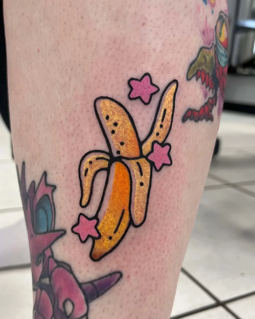 Playful and vibrant banana tattoo design