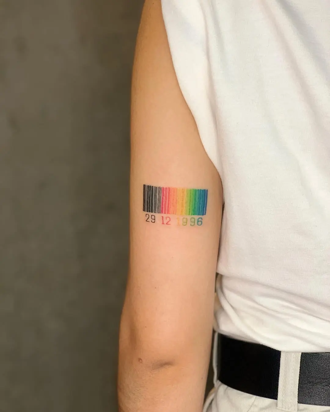 A vibrant barcode tattoo with a personal touch
