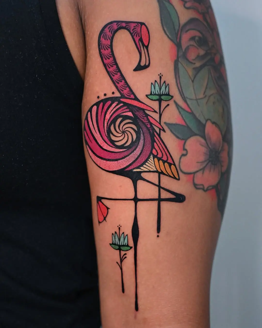 Vibrant flamingo tattoo with artistic flair