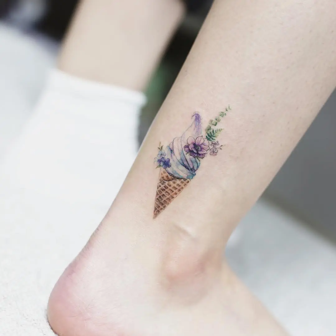 Charming ice cream cone tattoo with floral accents