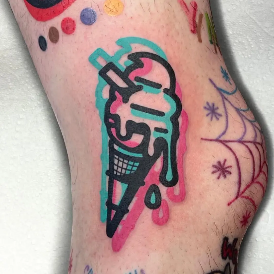 Whimsical ice cream cone tattoo on the leg