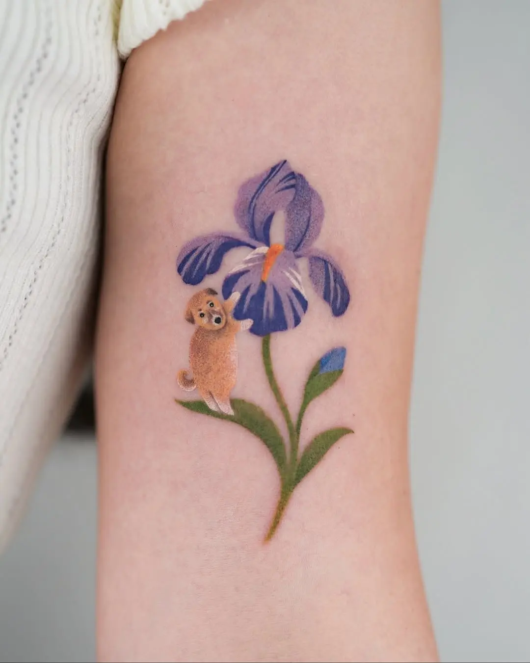 Charming Iris Tattoo with Playful Pup