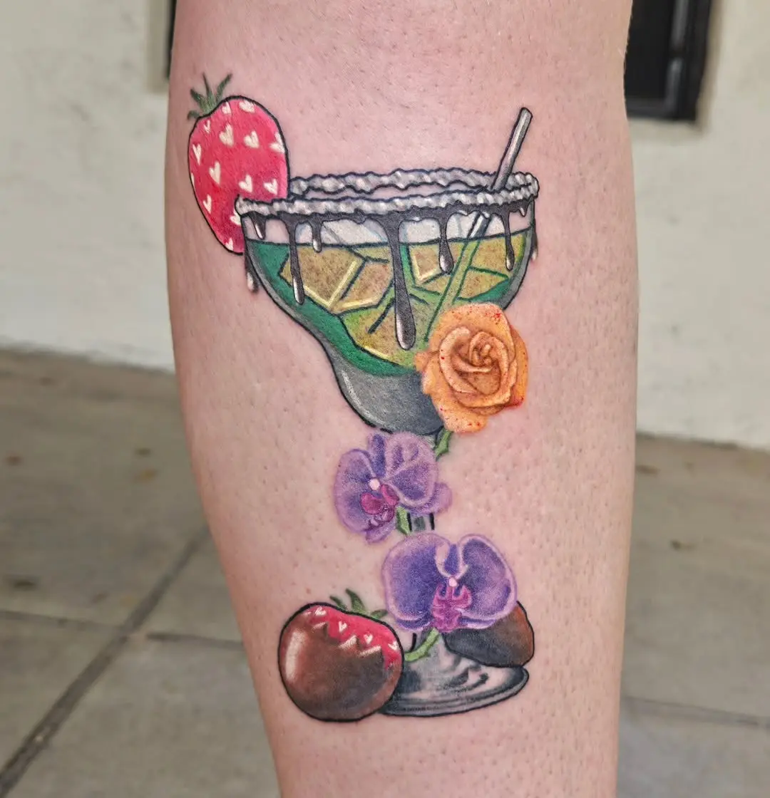 Vibrant tequila cocktail tattoo with floral accents