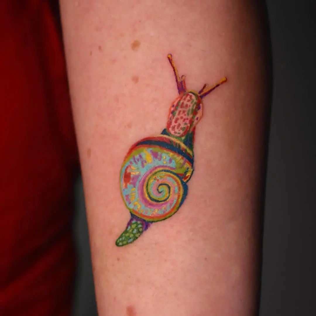 Vibrant snail tattoo showcasing intricate details