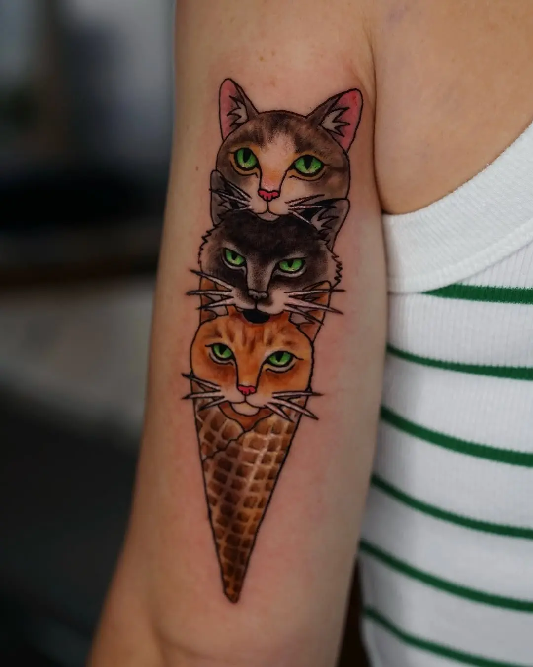 Colorful cats in an ice cream cone tattoo