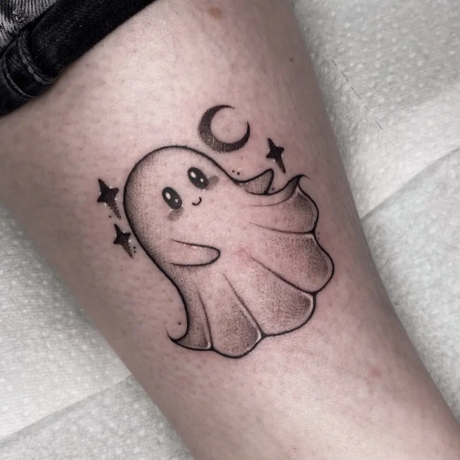 Whimsical ghost tattoo with celestial elements