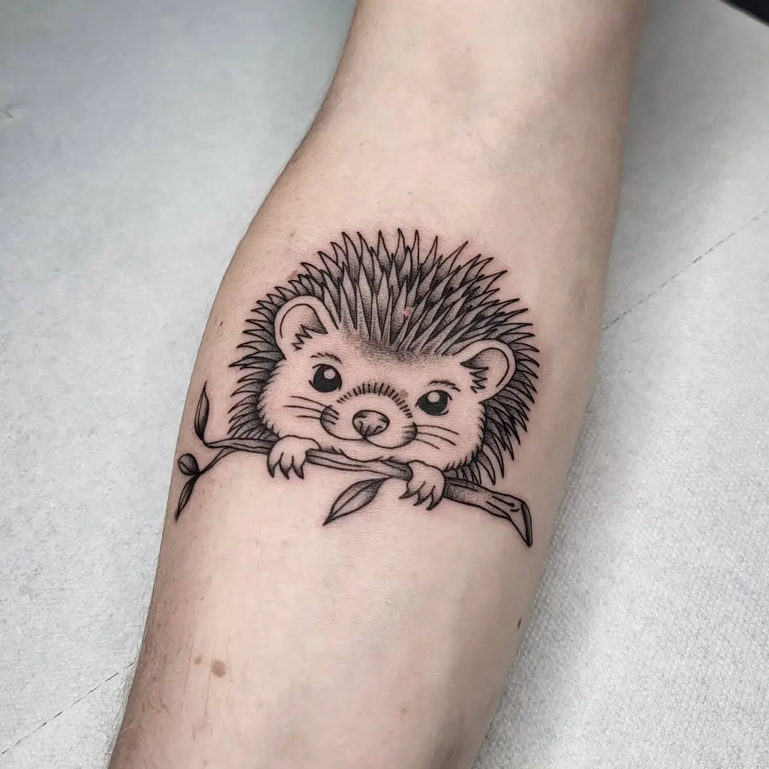 Charming hedgehog tattoo with natural elements