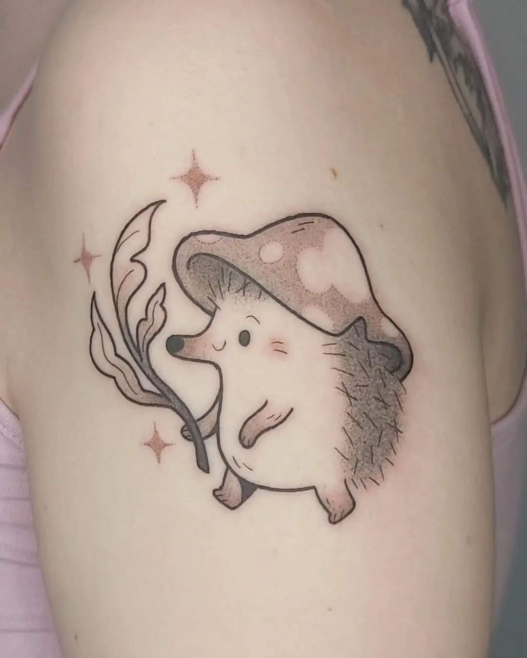 Adorable hedgehog tattoo with mushroom charm