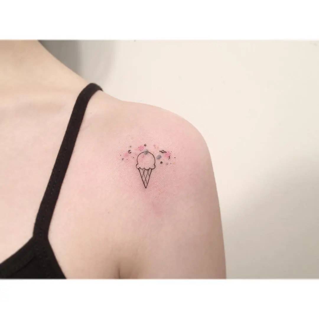 Charming ice cream tattoo with playful sparkles