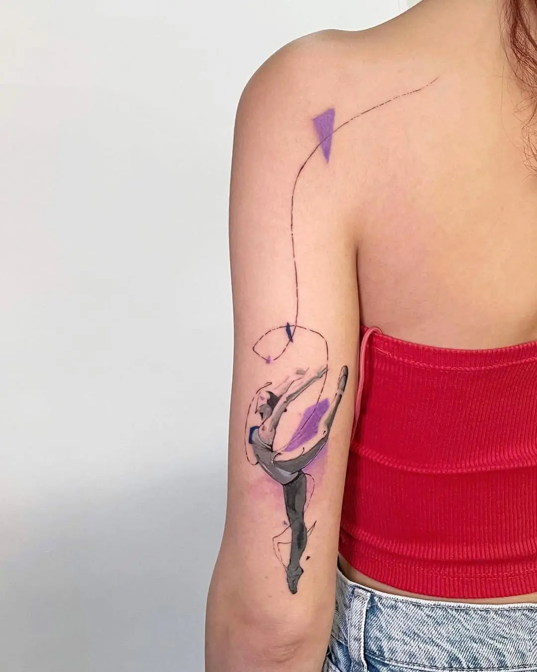 Artistic ballet dancer tattoo with vibrant colors