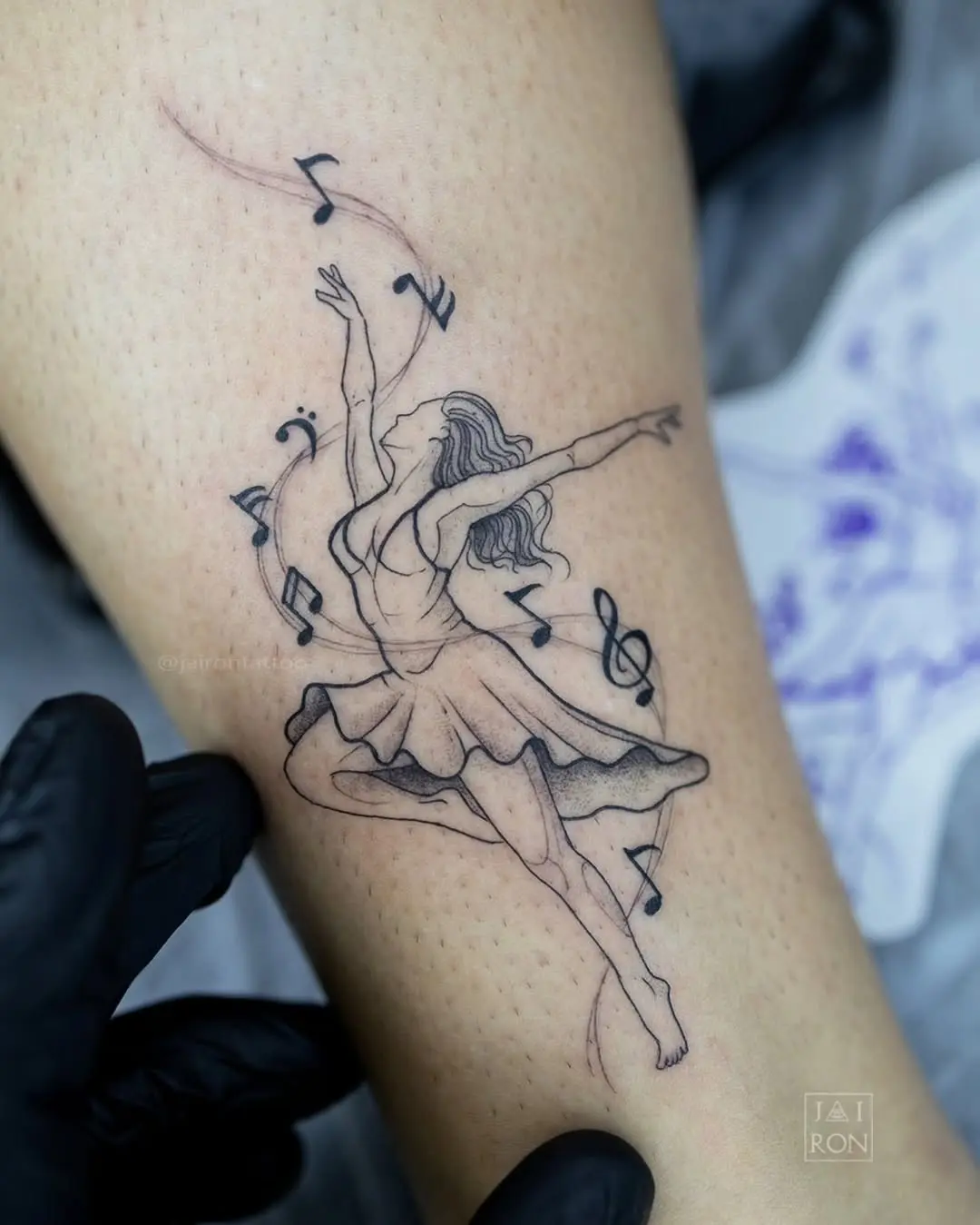 Elegant dancer inked in a musical flow