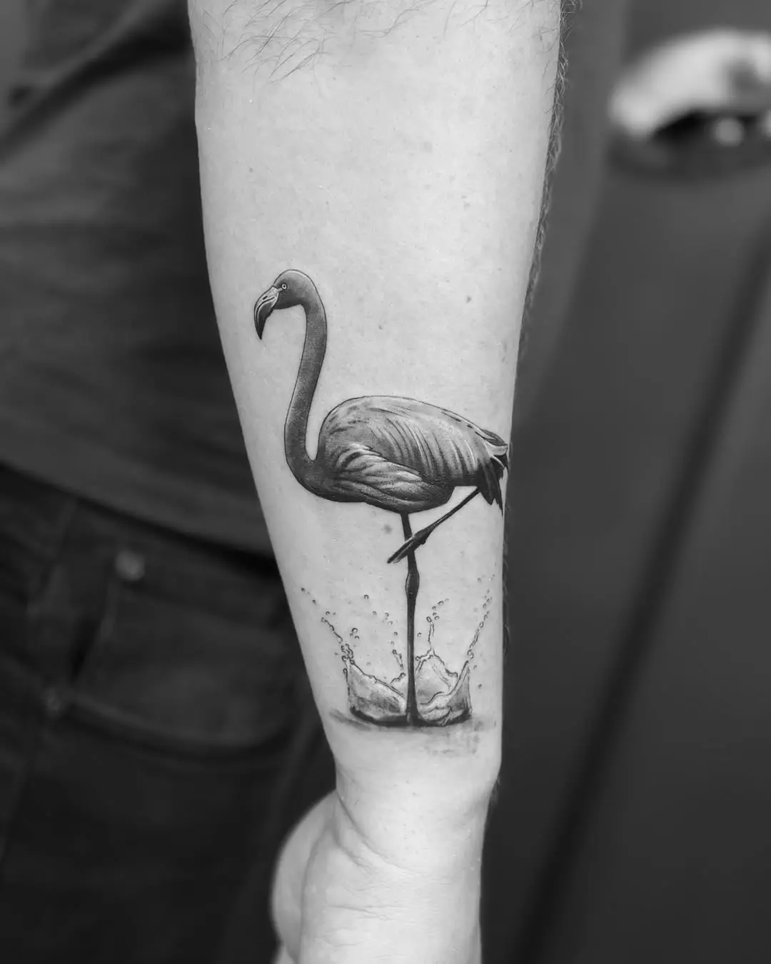 Elegant flamingo tattoo with water splashes