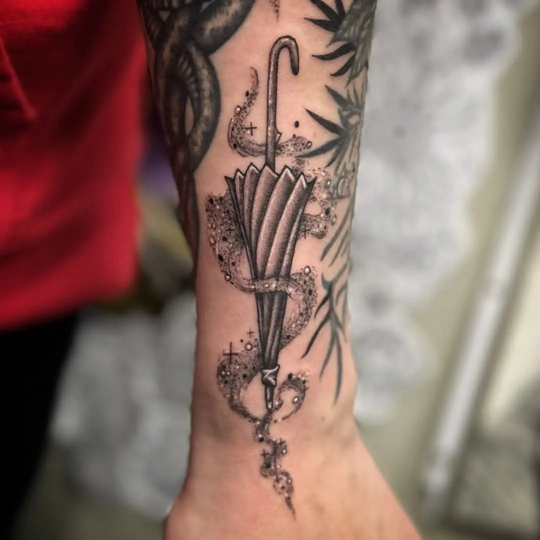 Elegant Umbrella Tattoo with Whimsical Details