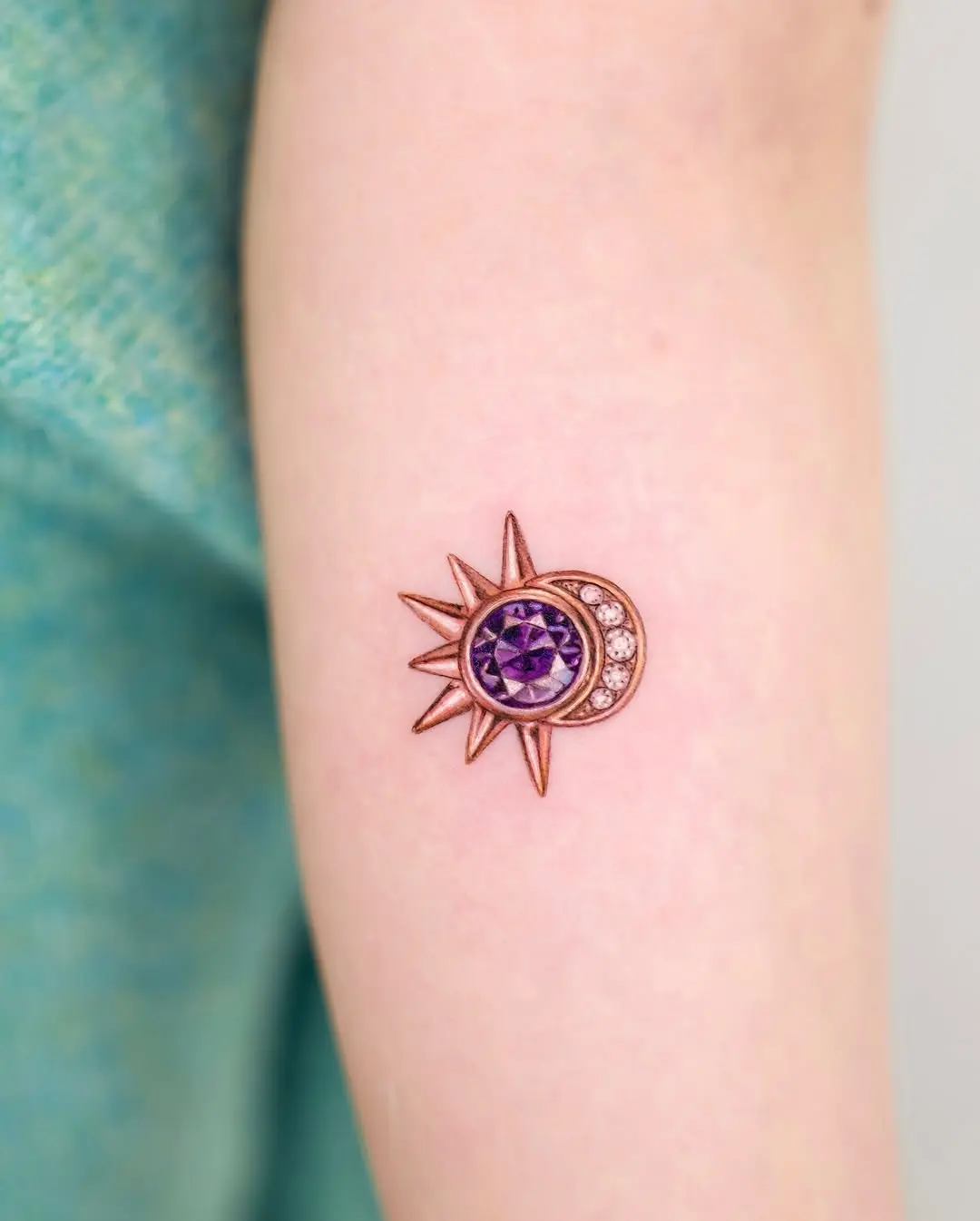 Elegant sun and moon diamond tattoo design