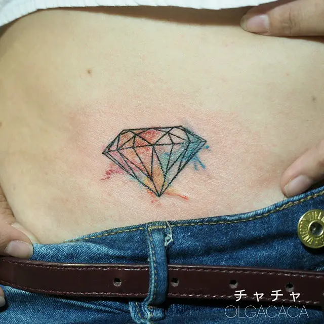 Vibrant diamond tattoo on the belly
