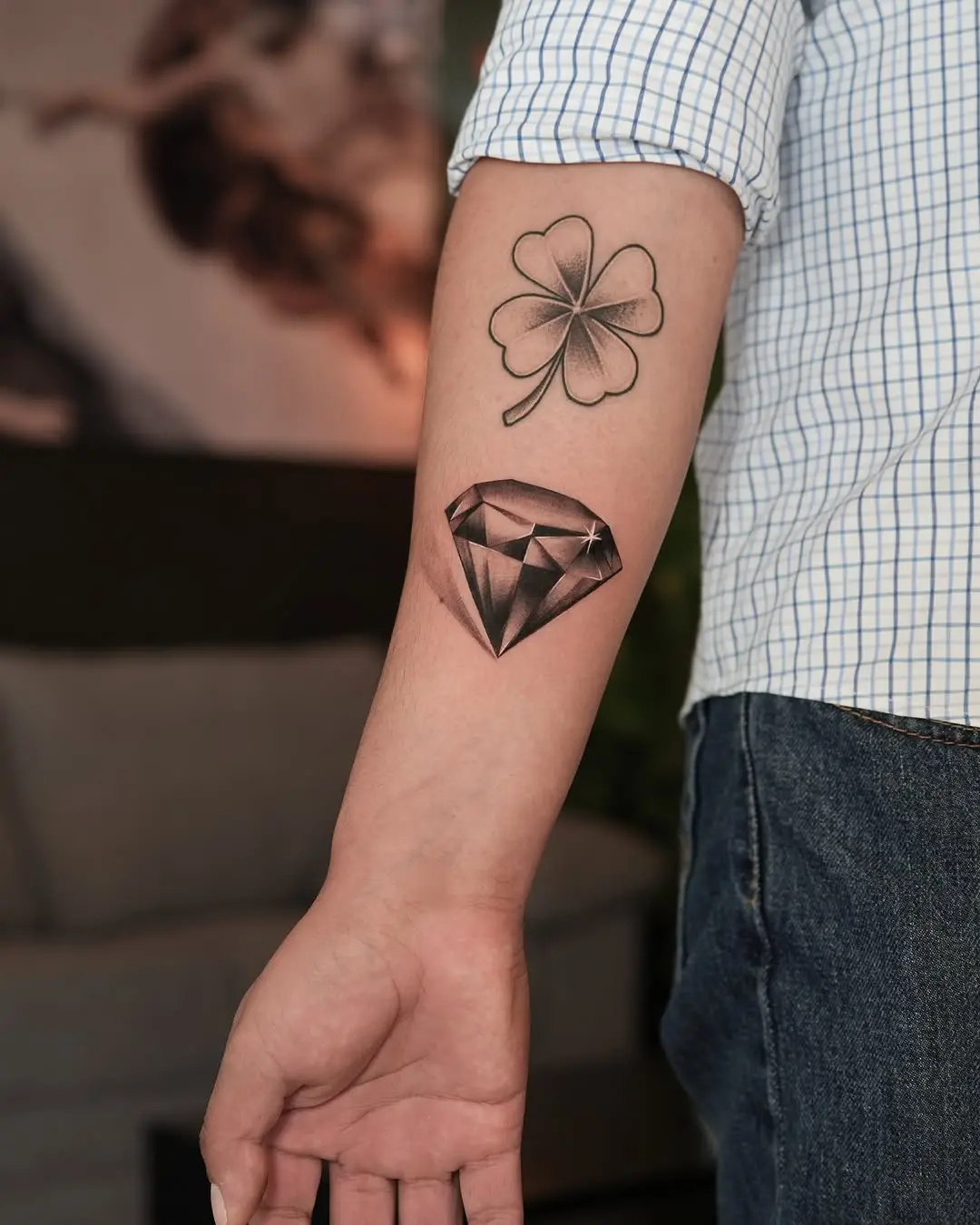 Stylish diamond tattoo paired with a clover.