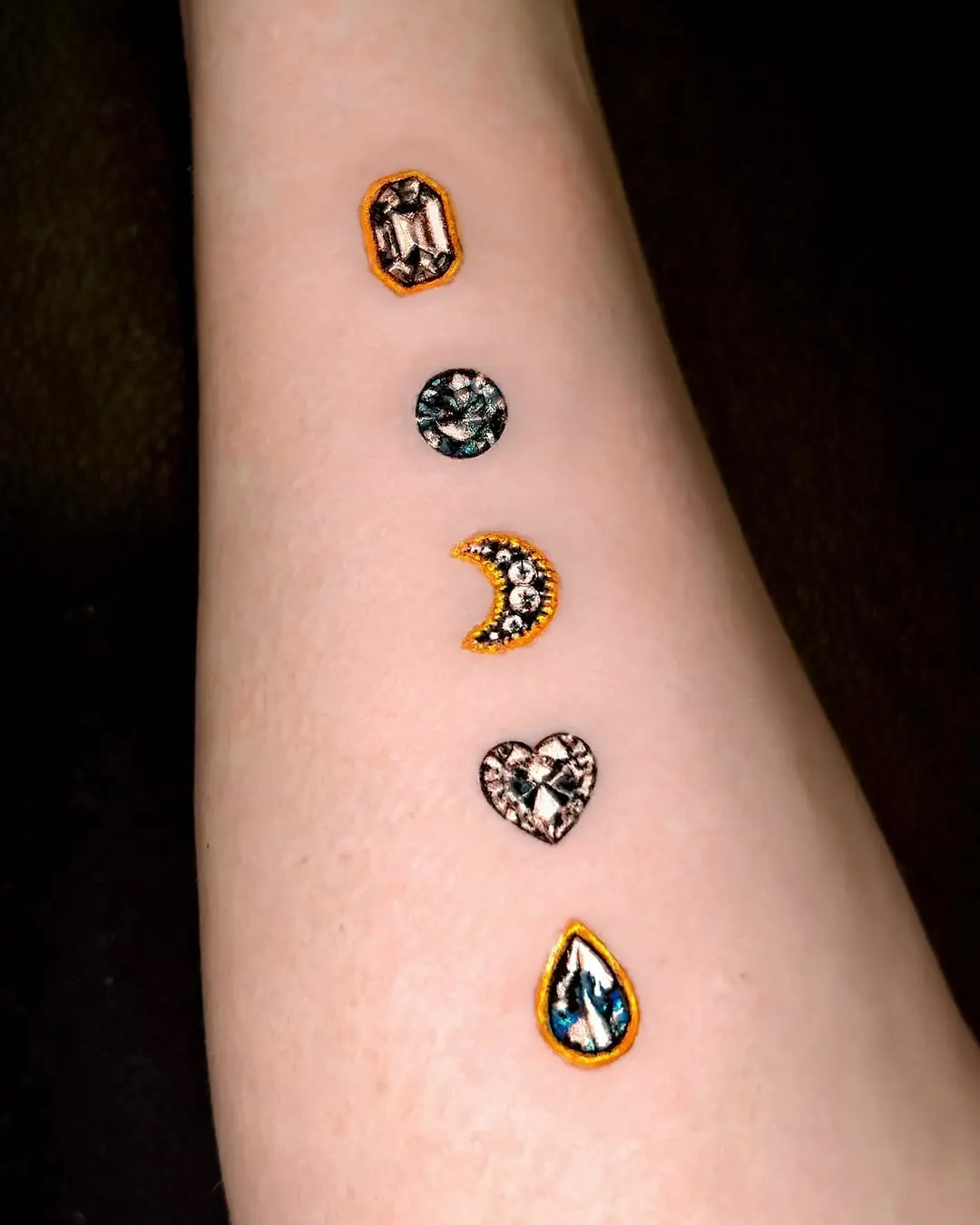 Glistening diamond tattoo designs on display