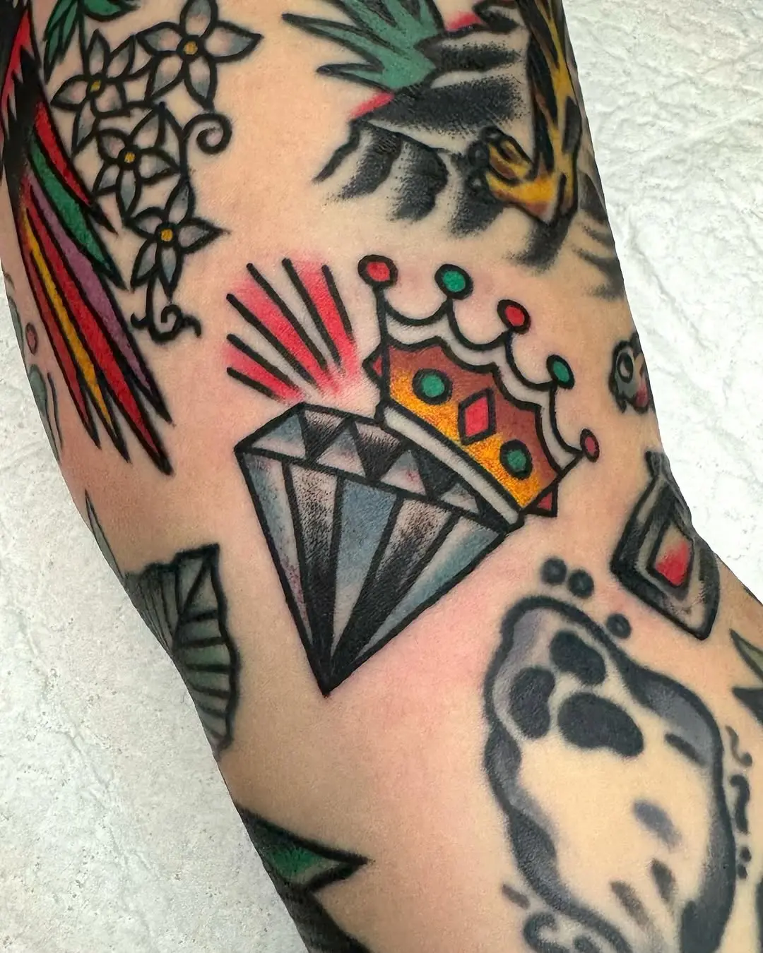 Stylish and bold diamond crown tattoo design