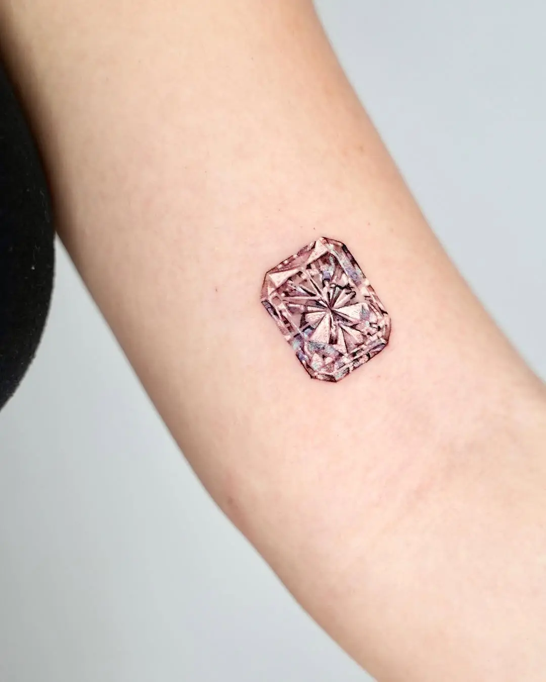 Stunning pink diamond tattoo design on skin