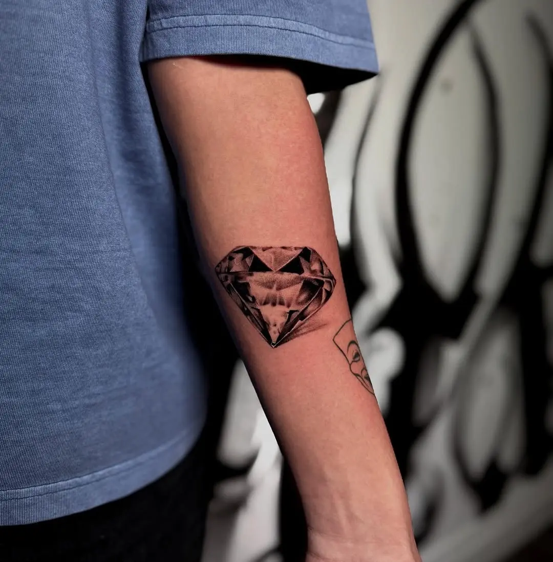 Stylish diamond tattoo on the forearm