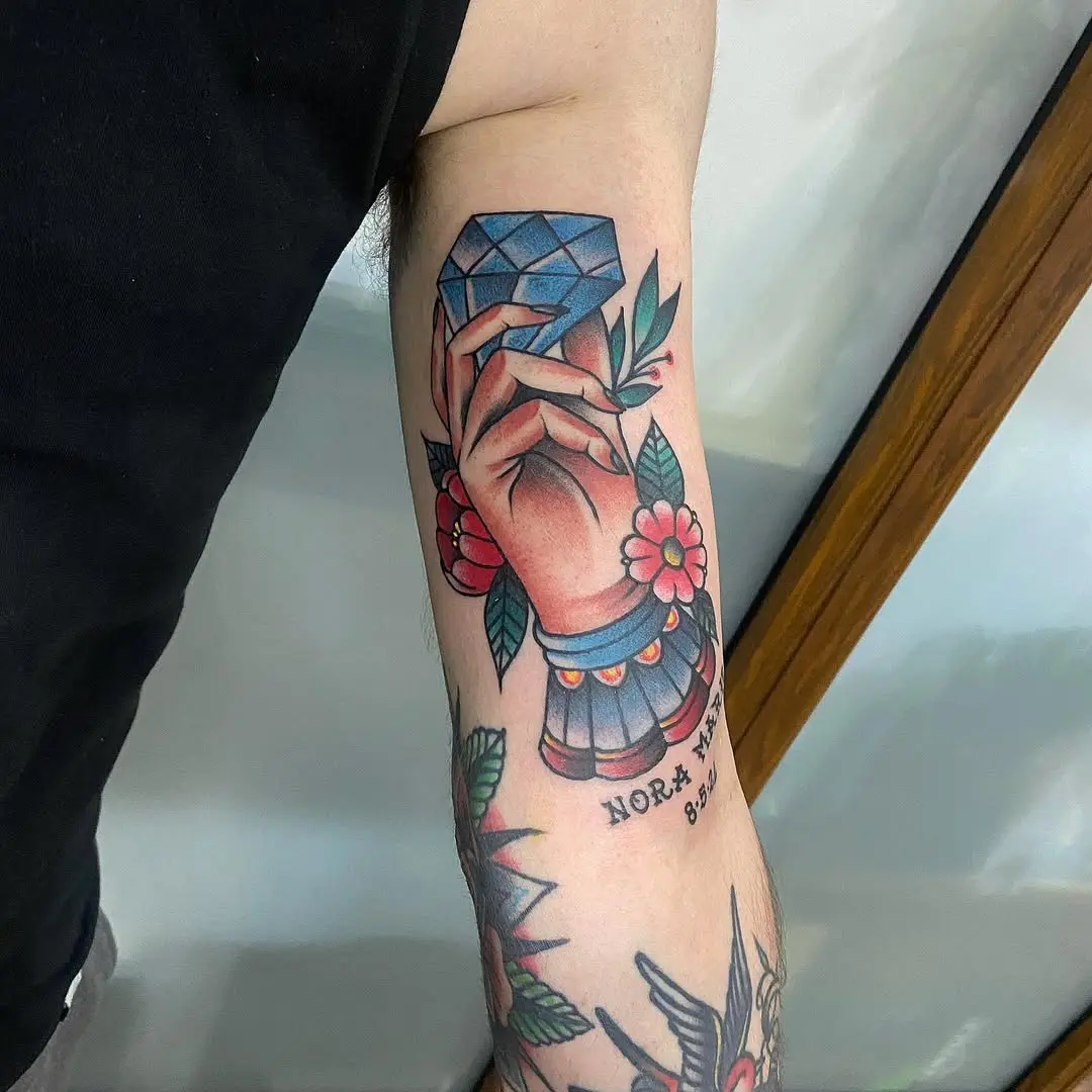 Elegant diamond tattoo with floral elements