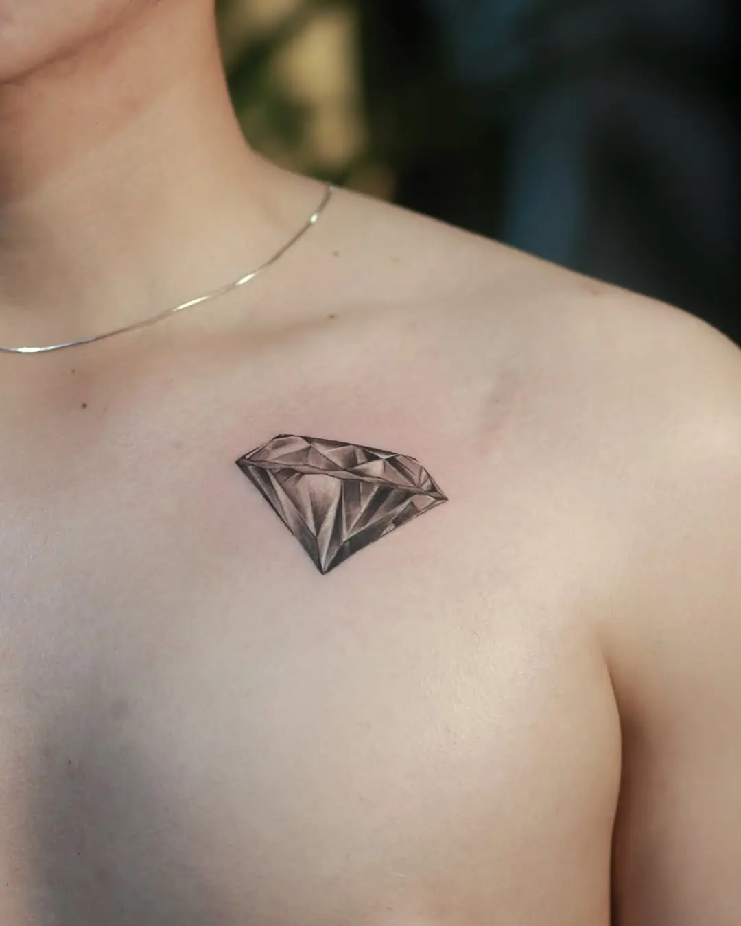 Realistic diamond tattoo on the chest