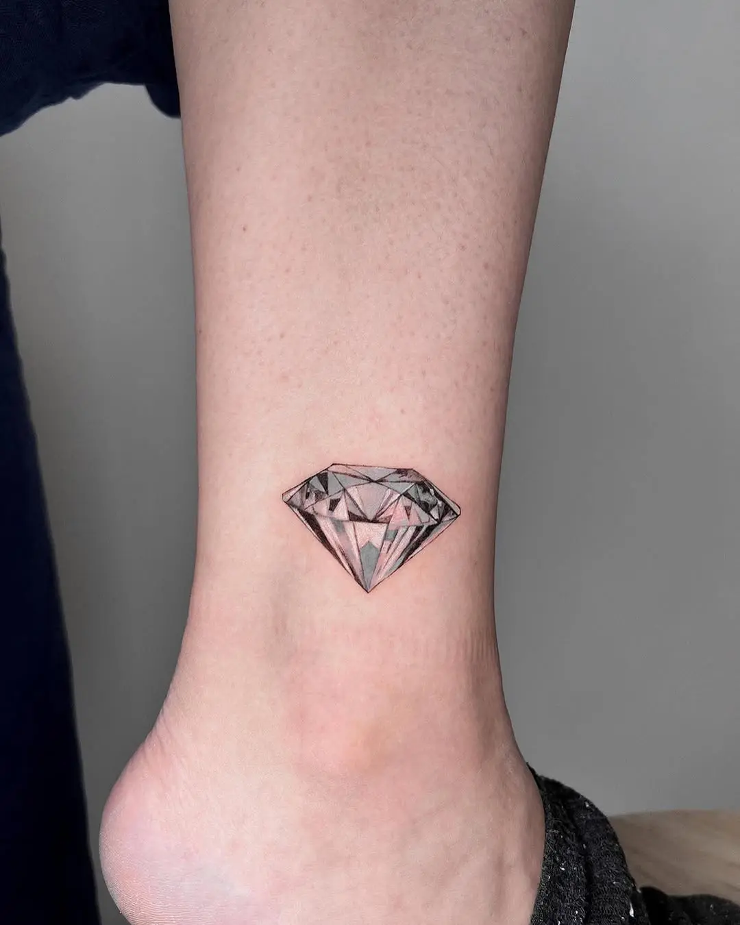Shimmering diamond tattoo on the ankle