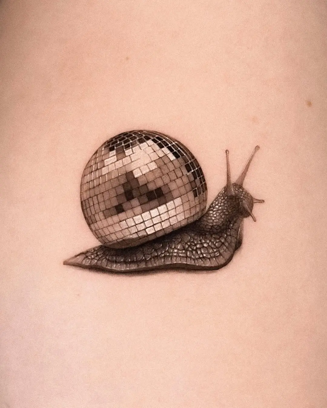 Whimsical snail with a disco ball shell