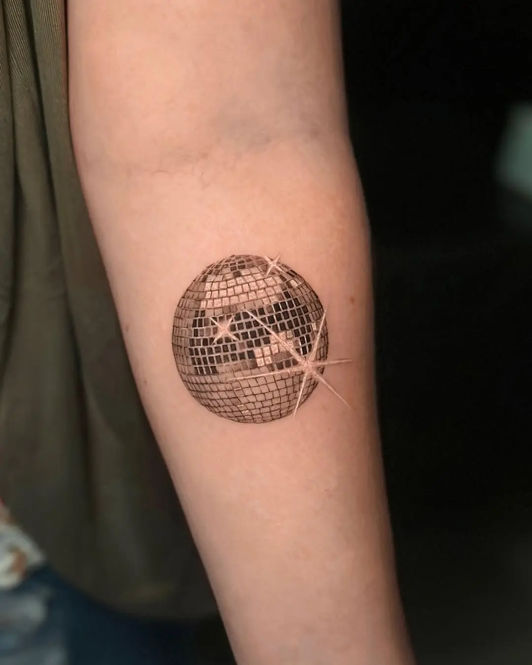 Stunning disco ball tattoo for dance lovers